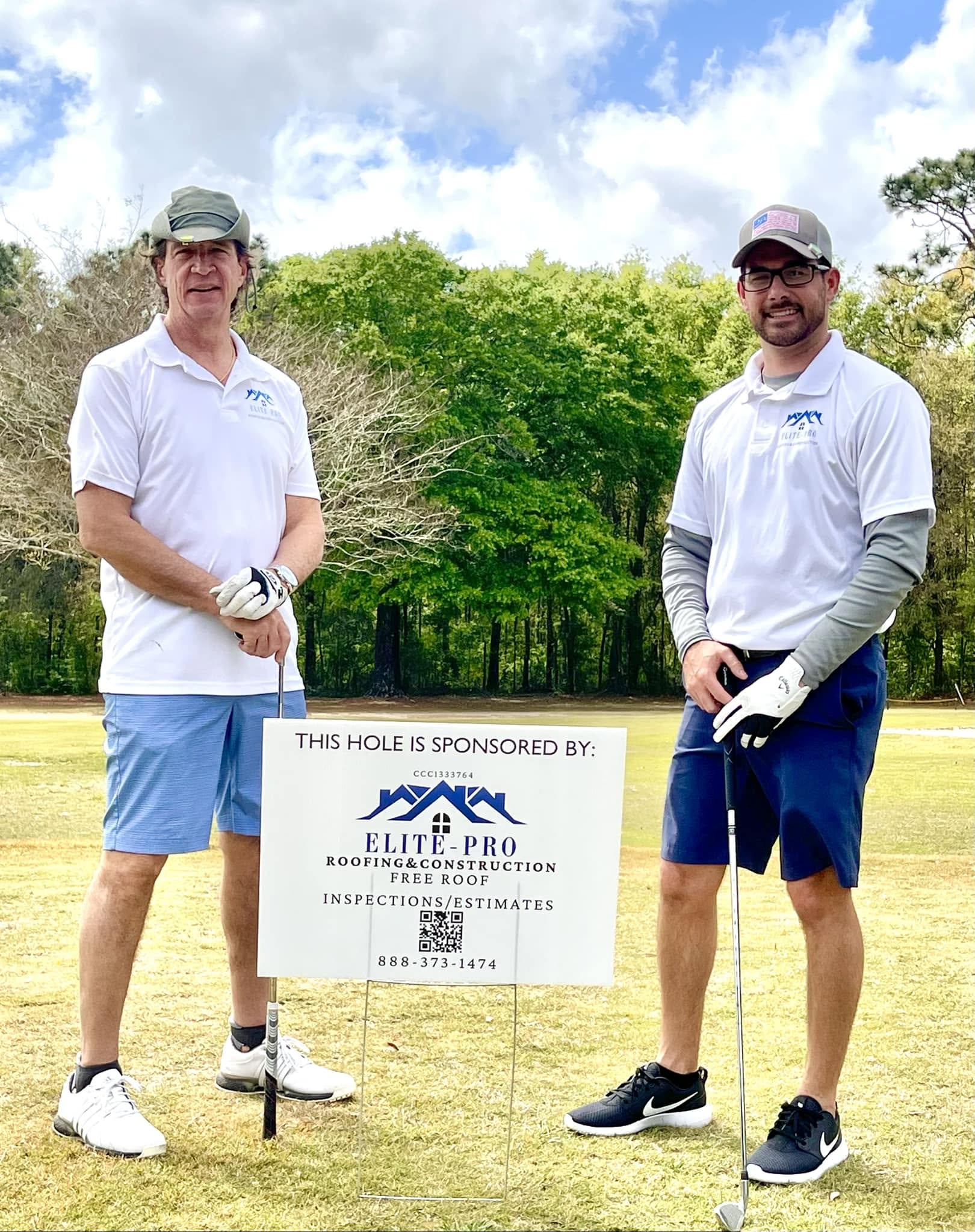 Elite-Pro team members at a community golf event sponsored by Elite-Pro Roofing & Construction