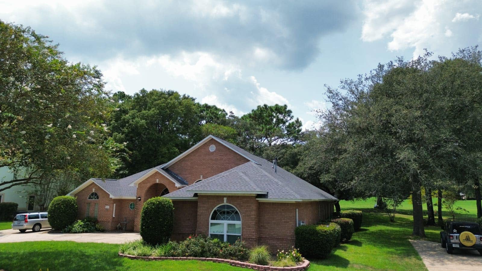 Residential roof replacement on a brick home in Pensacola, FL by Elite-Pro
