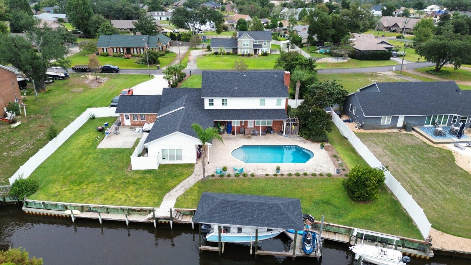 Aerial view of a completed Elite-Pro roof replacement on a waterfront Northwest Florida home